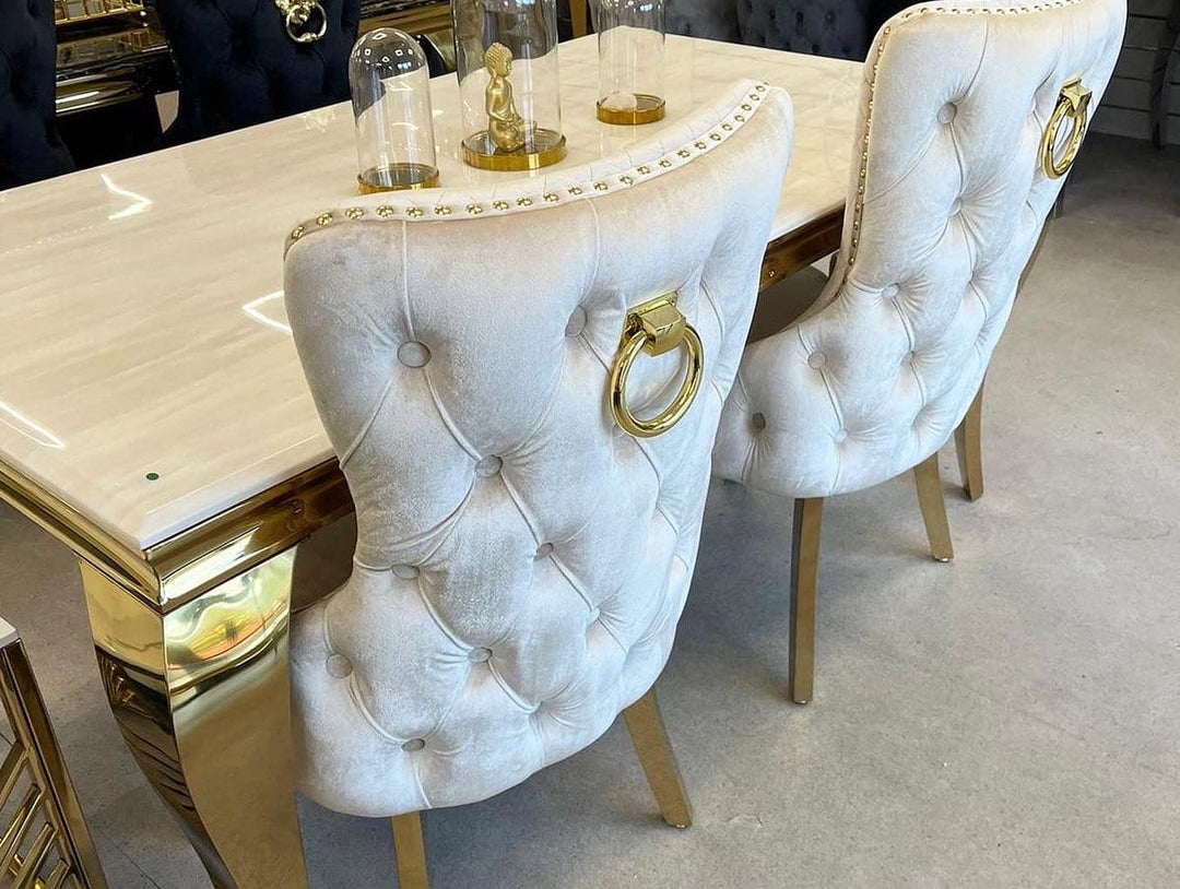 Louis Gold Cream Marble Dining Table With Shimmer Gold Ring Knocker Dining Chairs - Belmont Interiors